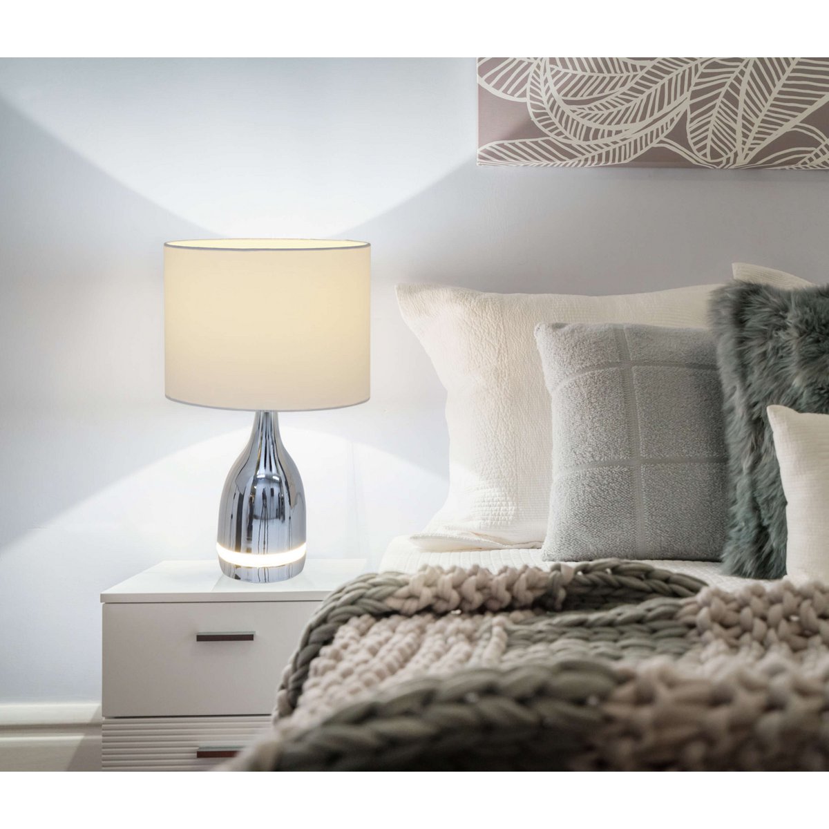 The "Cosima" LED table lamp is 43.5 cm high, umbrella Ø 25 cm, made of metal, plastic, textile material in the colors chrome and white. Both integrated LEDs in the light foot and E14 version