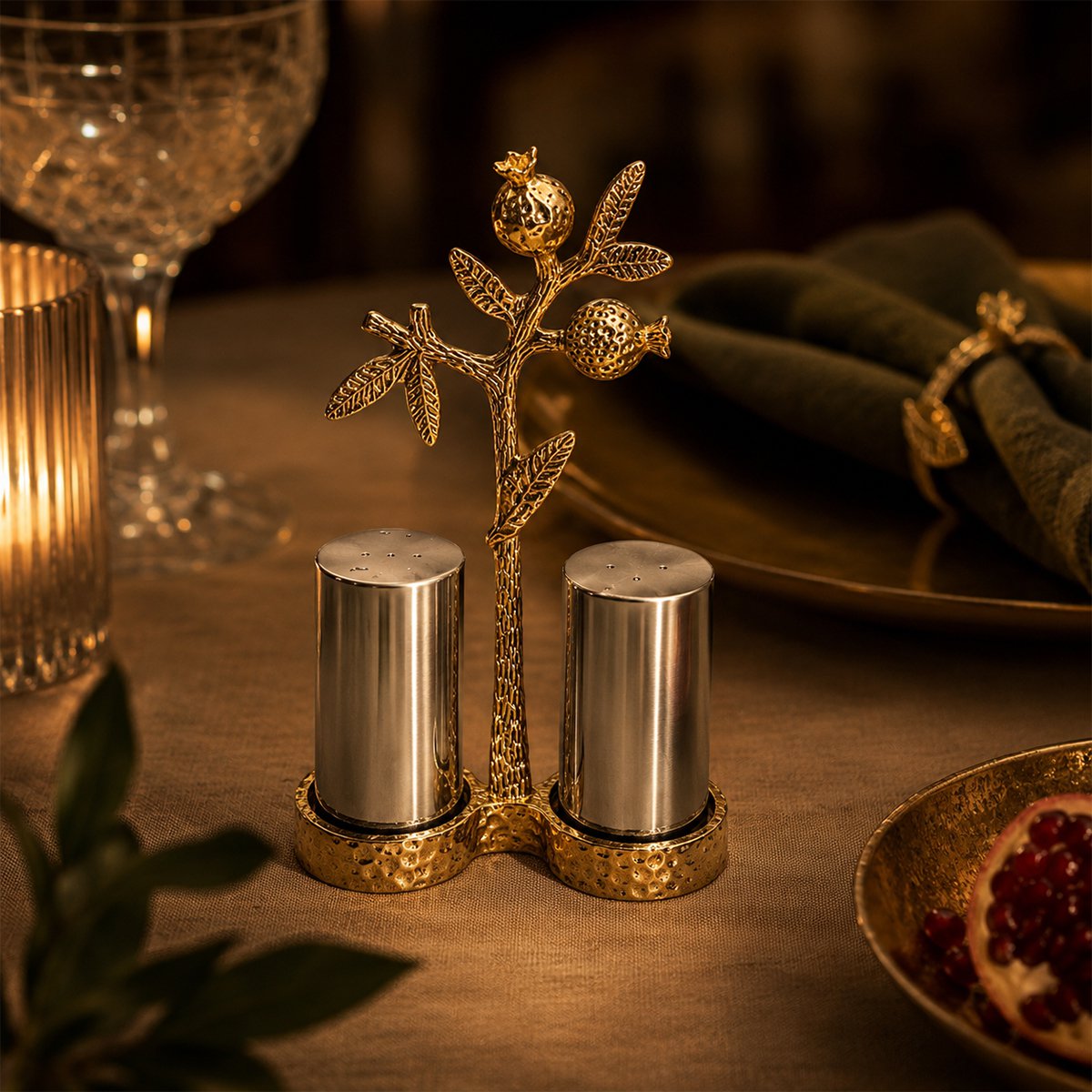 Gold salt and pepper shakers with pomegranate holder